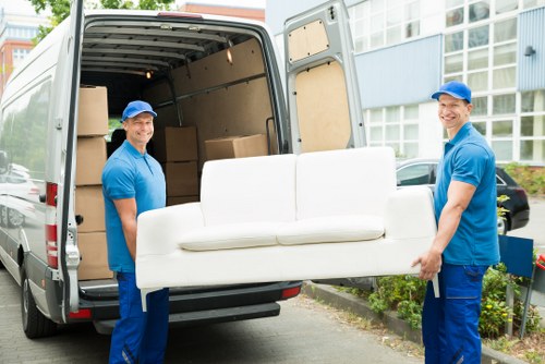 Removal team preparing boxes and furniture safely