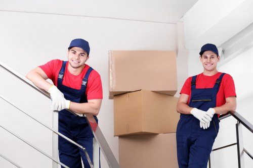 Boxes and furniture being loaded into a removals van
