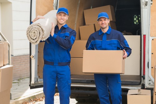 Office movers handling equipment and furniture in a local business area