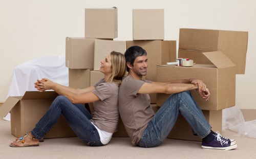 Office furniture and boxes prepared for local removal service