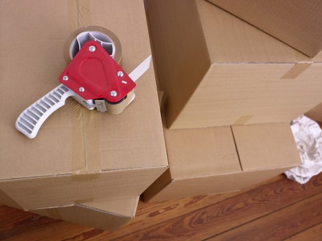 Furniture being loaded carefully into a moving van in South West London