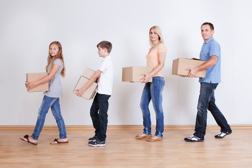 Removal crew handling furniture with care during a move